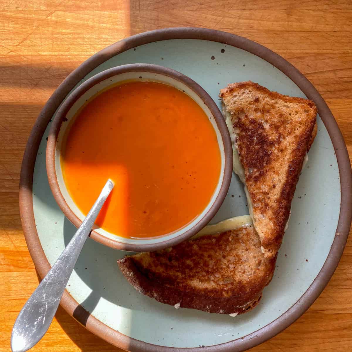 Tomato soup and grilled cheese served on East Fork pottery.