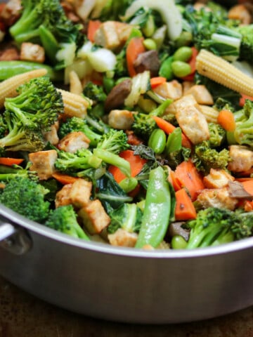 Mixed vegetables and tofu in a large sautè pan.