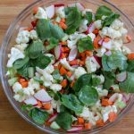 Salad of raw cauliflower, carrots, cucumbers, raddish, and mustard vinaigrette