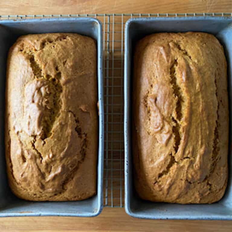 2 loaves of pumpkin bread in blue loaf pan