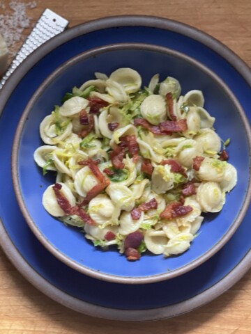Bowl of pasta with bacon and Brussels sprouts