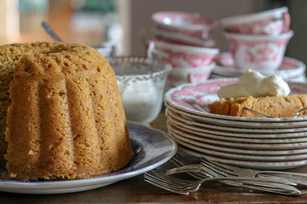 Pumpkin steamed pudding on a blue and white spode plate.